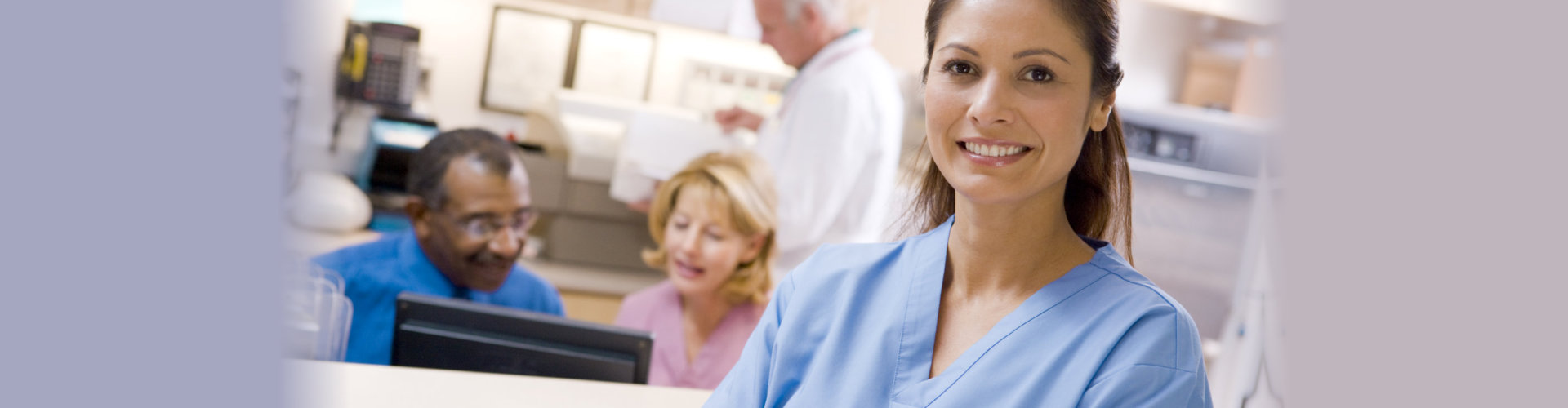 nurse standing in front of busy elderly couple